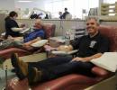 Suffolk County Executive Steve Bellone, right, and Comptroller Joseph Kennedy donated blood Jan 28 at a blood donation center in Bohemia. 