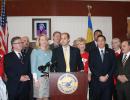 Leg. Rob Calarco at the podium discusses passage of his bill, IR 2025, requiring county roadways to be designed to accommodate all users. (left to right) Legislators Wayne Horsley and Kara Hahn (a co-sponsor of the bill); Leg. Calarco, Will Stoner of the AARP; Leg. Ricardo Montano. (Rear left to right) Eric Alexander of Vision Long Island; Sal Russo, 2nd vice president of SCAME; and Leg. William (Doc) Spencer. 